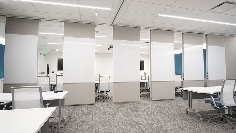 A large empty office with wall dividers