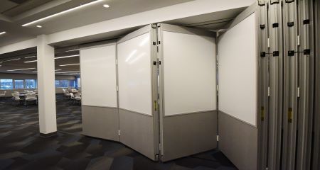 A room with a sliding door between two walls