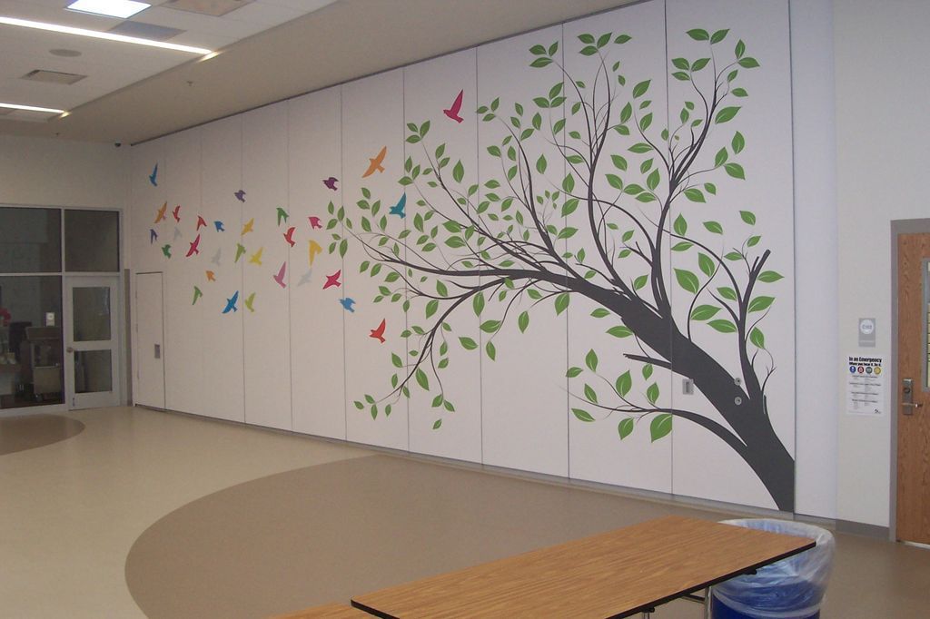 Sliding wall with a drawing of a tree and birds