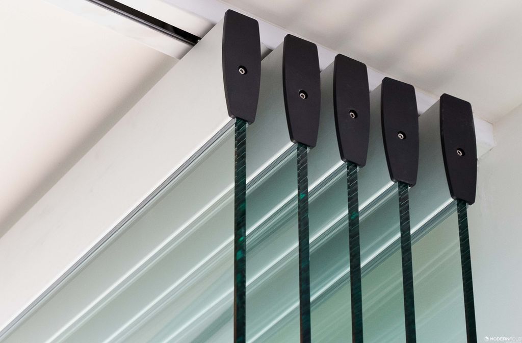 A close-up of a row of glass sliding walls