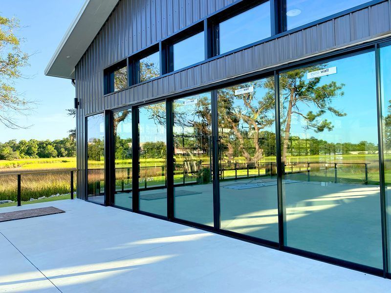 A large building with sliding walls and a balcony