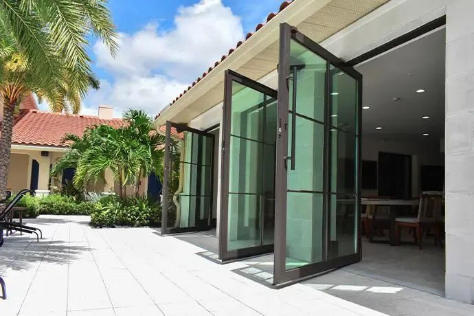 A house with pivoting glass doors