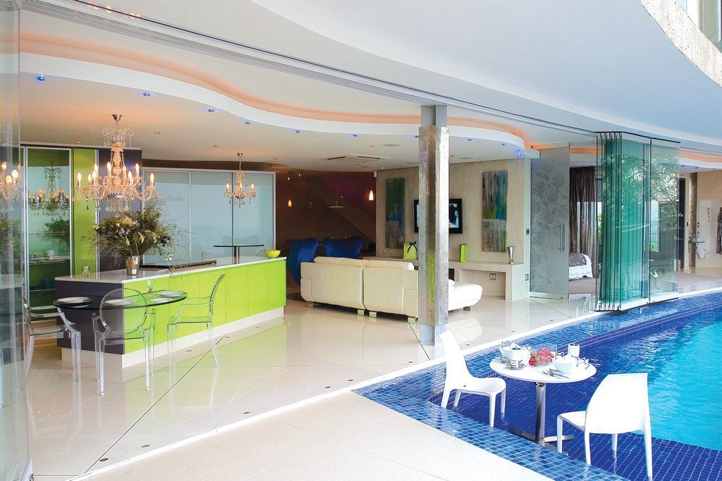 Pool area with stacking wall divider