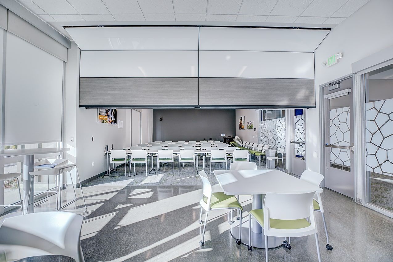 A large room with tables and chairs