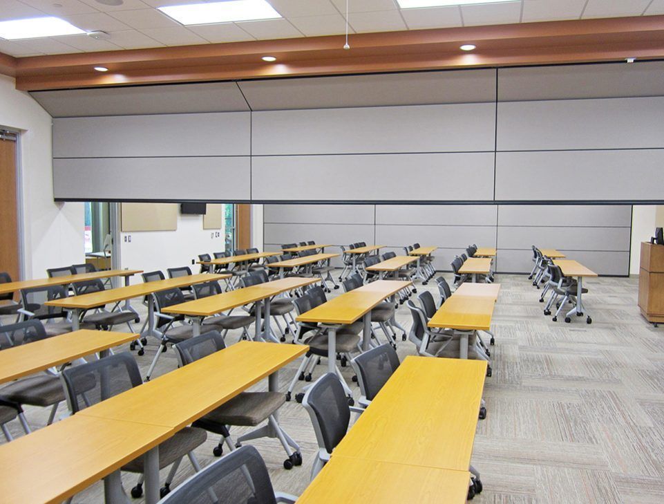 A large room with yellow tables