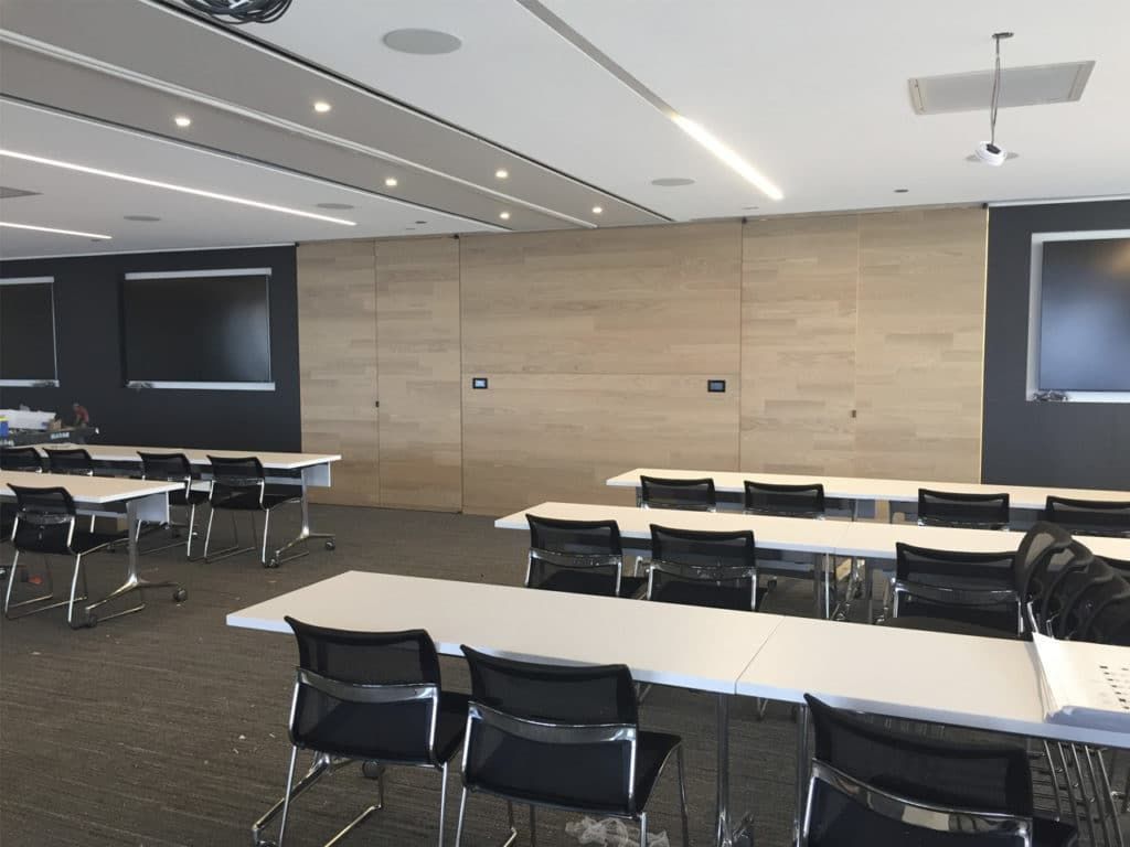 A large room with tables and chairs in it