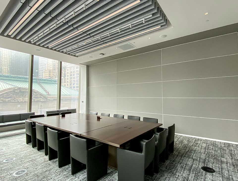 A conference room with a long table and chairs