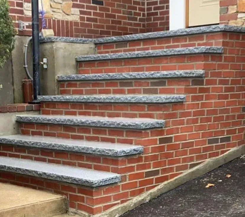 A set of stairs built into a brick wall