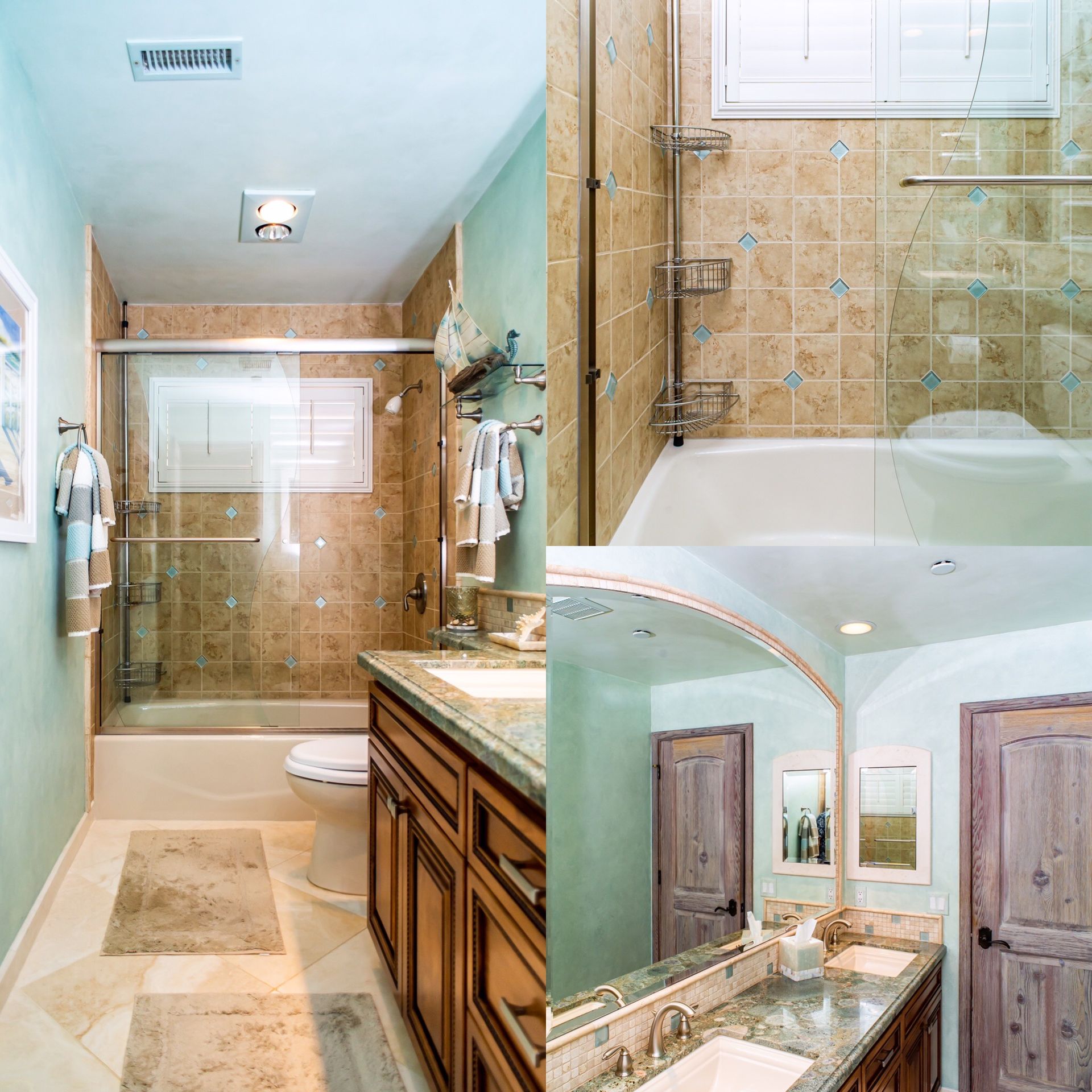 Bright beige bathroom with glass shower, white tub, wood vanity, and skylight.