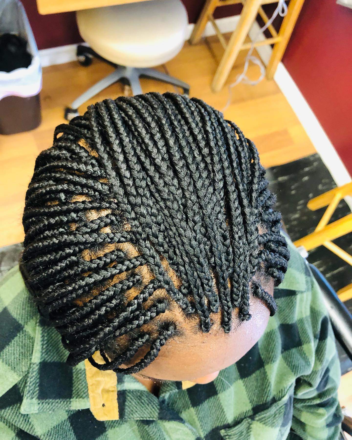 Back view of African American woman with long brown hair extensions.