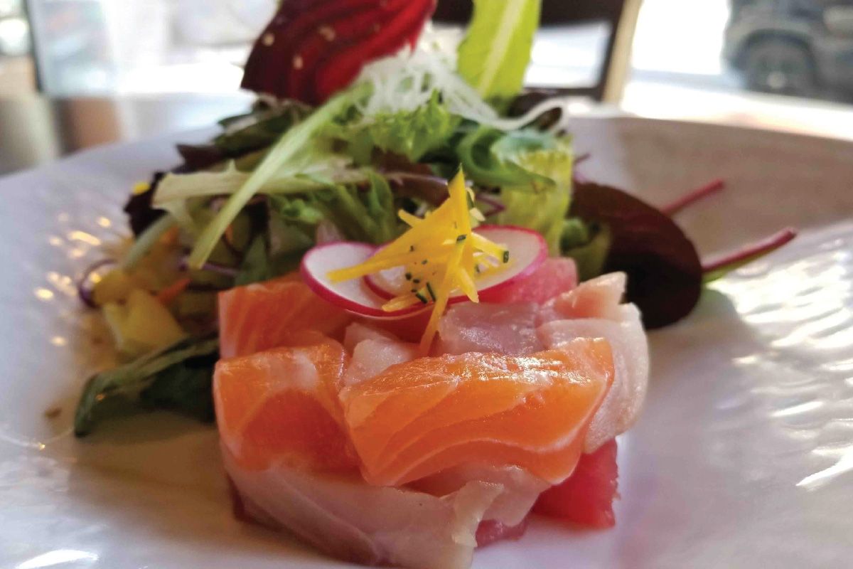 A close up of a salad on a white plate