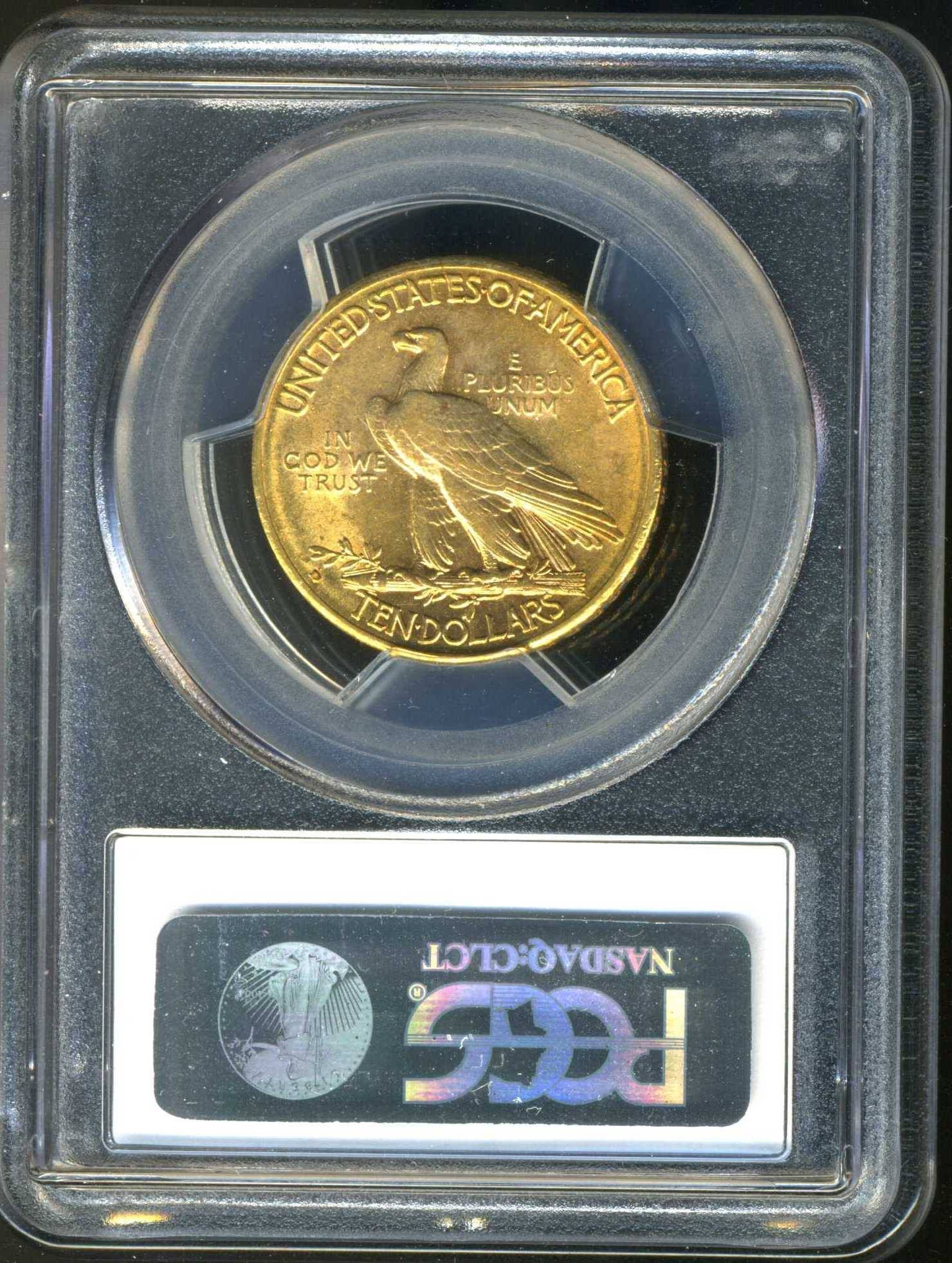 Gold coin encased in clear plastic with text 