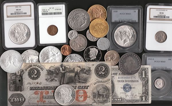 Assortment of coins and two vintage paper bills on a black surface; some coins in protective cases.