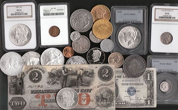 Assorted antique coins and two antique paper bills on a black surface. Coins include silver, gold, and encapsulated examples.