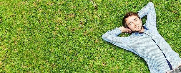 Happy customer lying in the grass