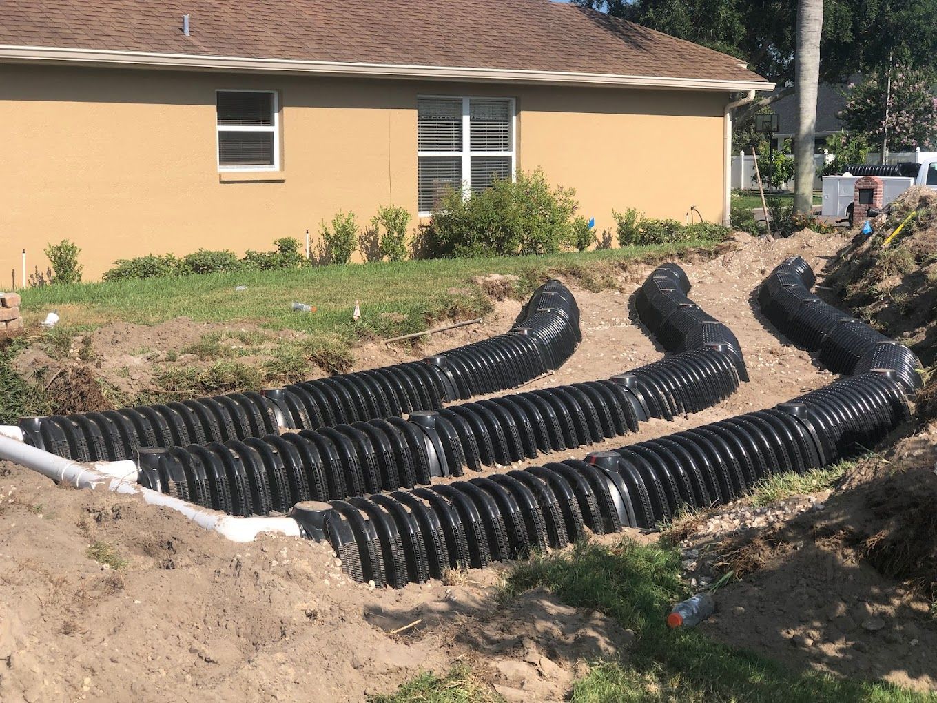 A house with a lot of drain pipes in front of it