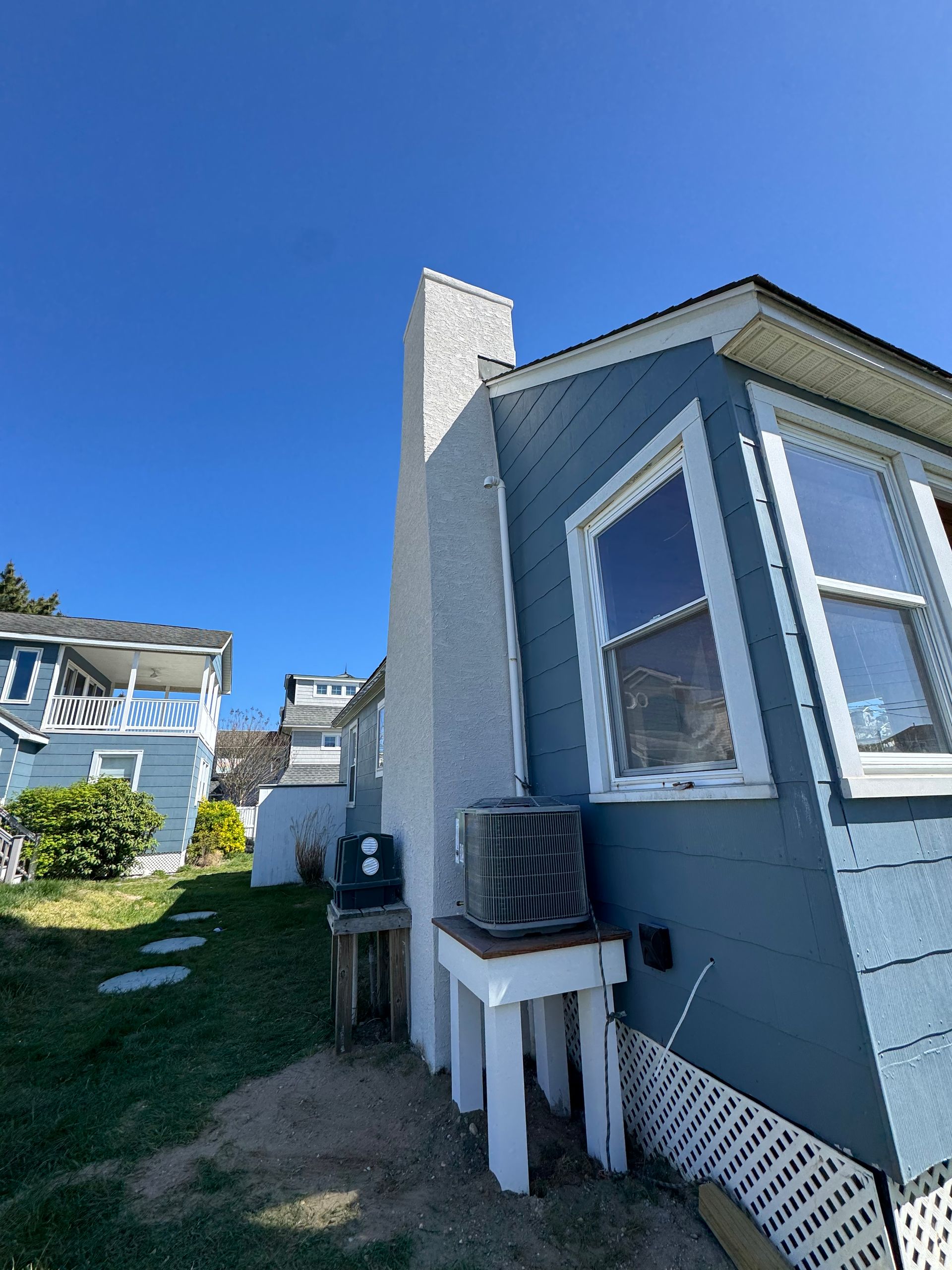 A house with a chimney on the side of it