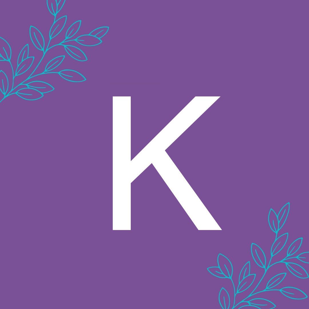 The letter k is on a purple background with leaves