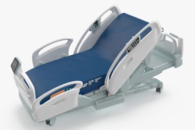 A modern medical hospital bed with a blue mattress, adjustable side rails, and white frame on a white background.