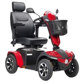 A red four-wheeled mobility scooter with a black leather seat, headrest, armrests, and a front storage basket.