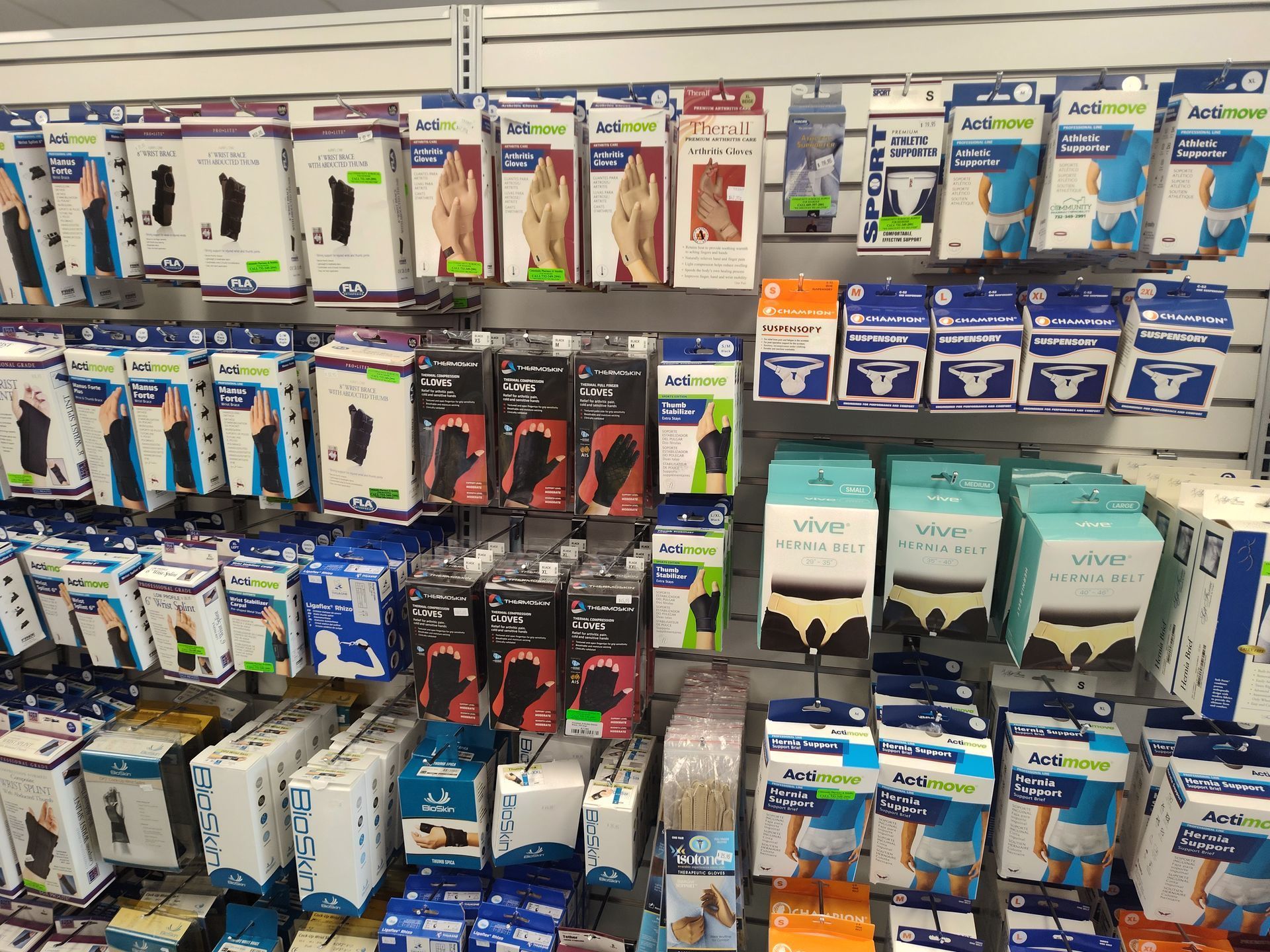 Shelves stocked with various medical support braces and devices in a store.