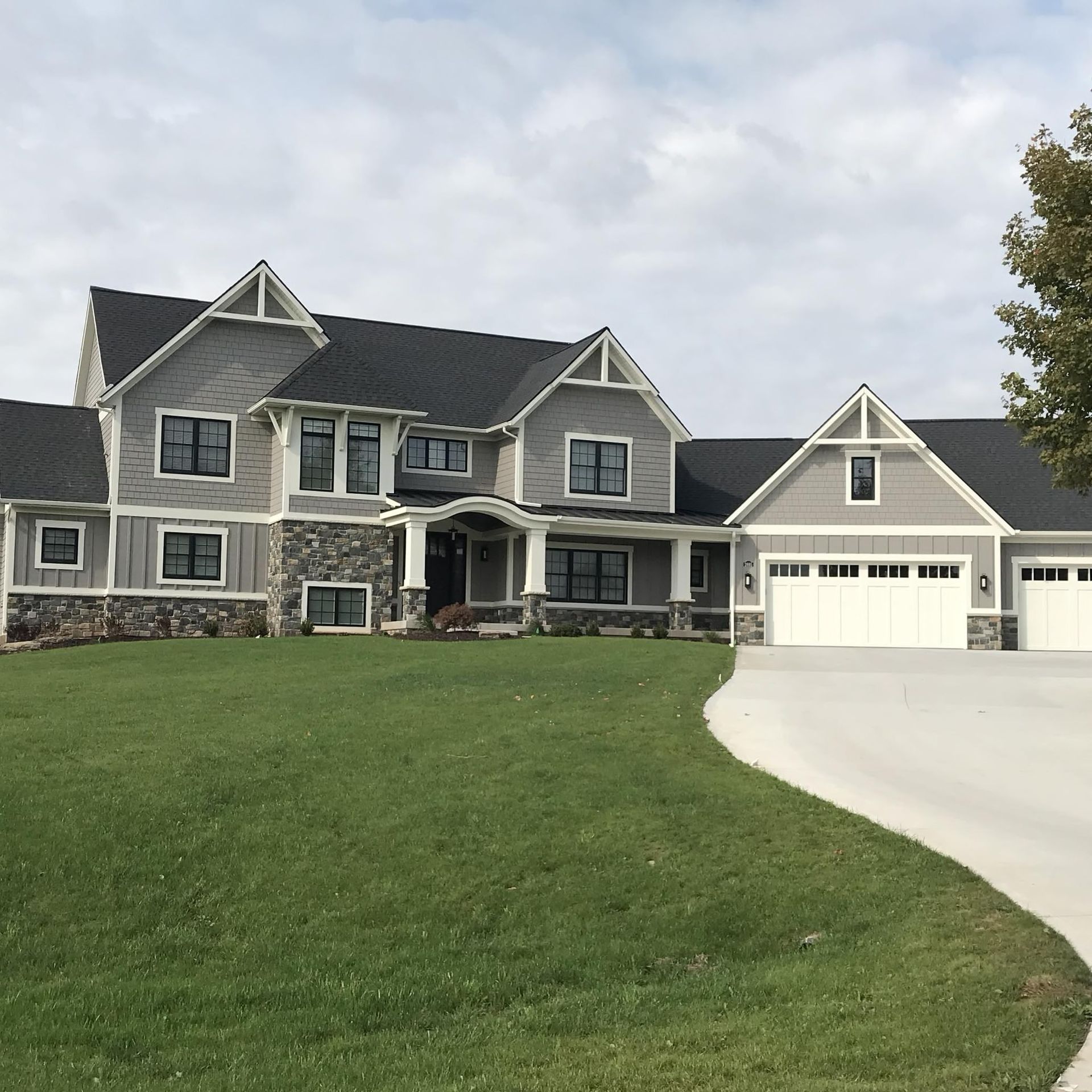 A large house with a driveway leading to it