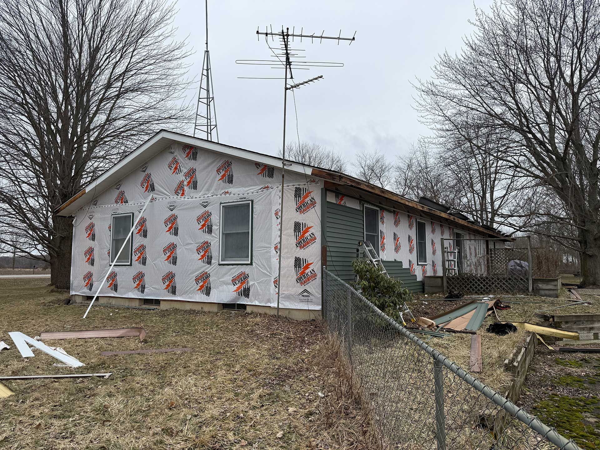 a small house is being remodeled in a rural area