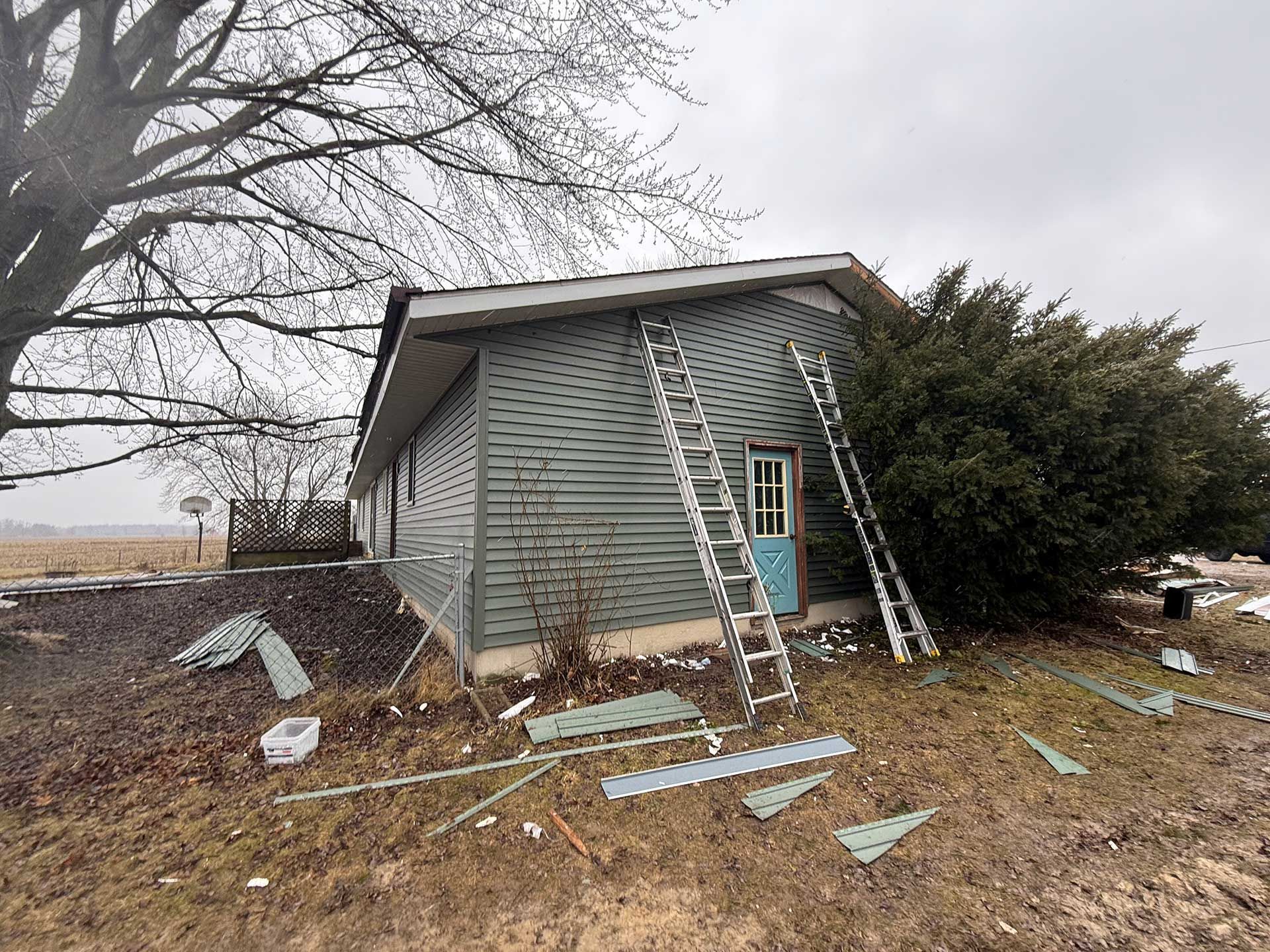 a house with a ladder on the side of it