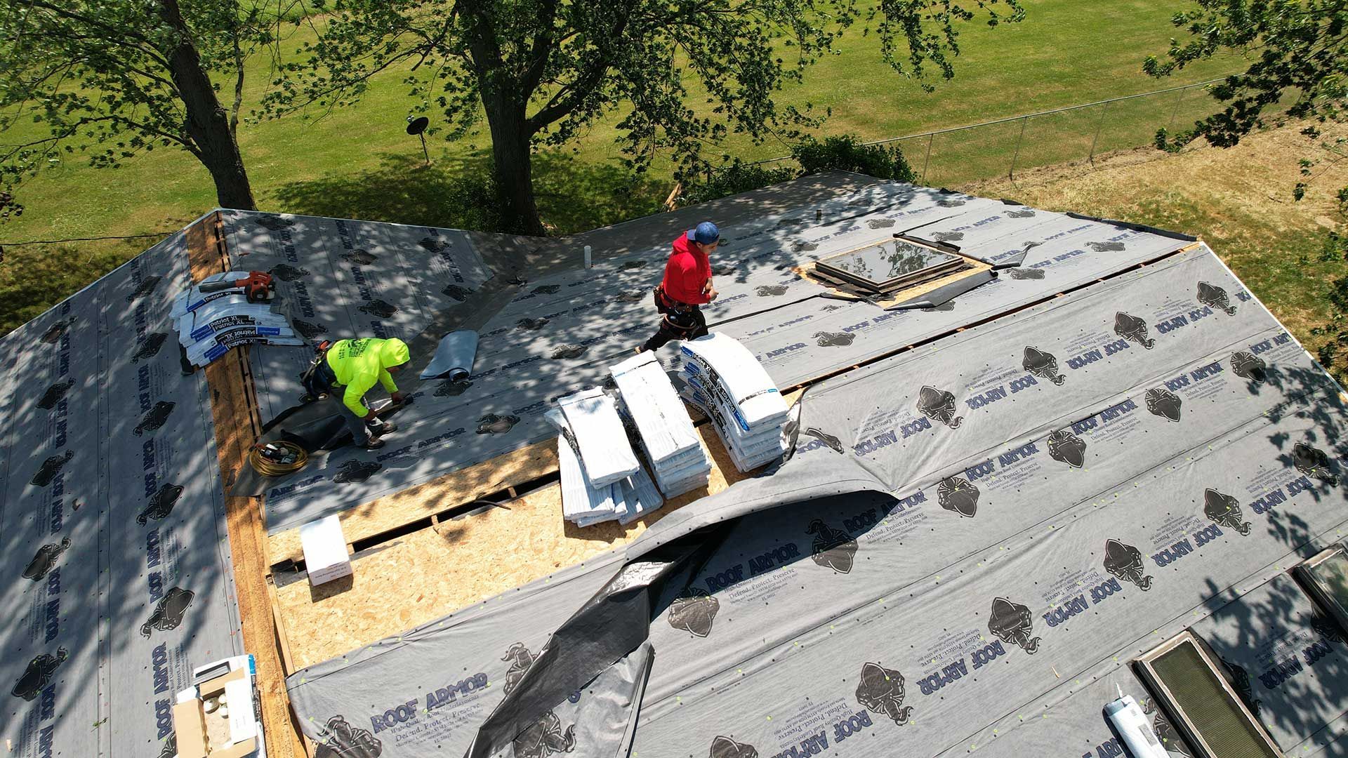 a group of people working on a roof