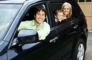 Happy family inside the car
