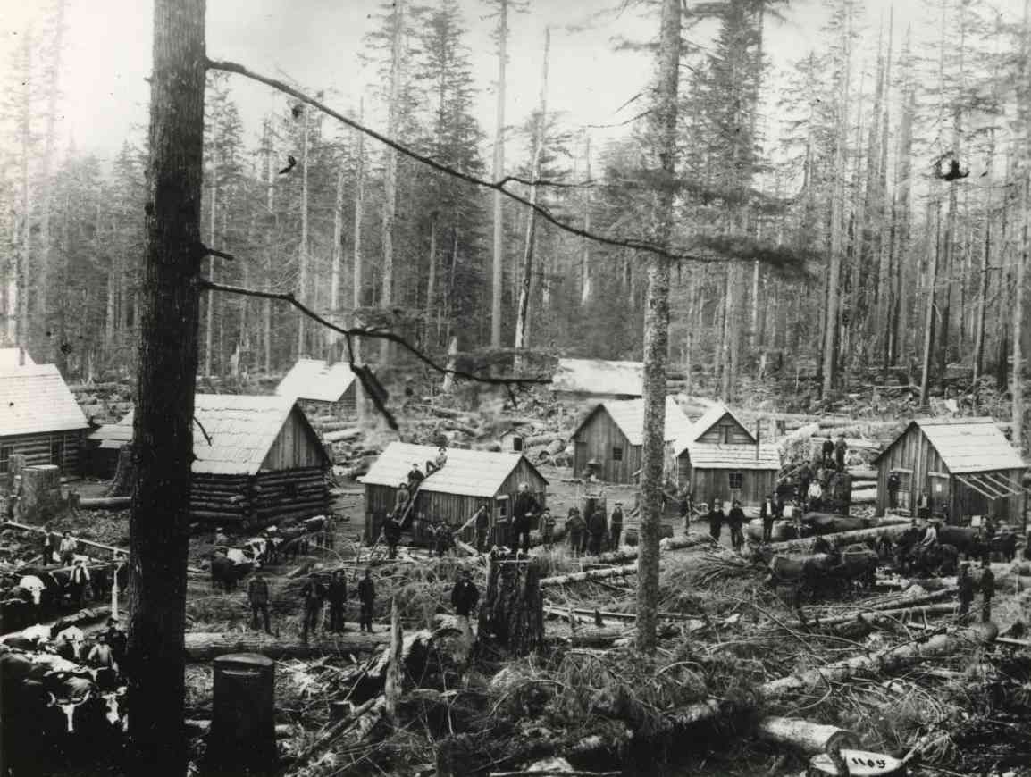 Logging camp with workers and cabins in a forest clearing