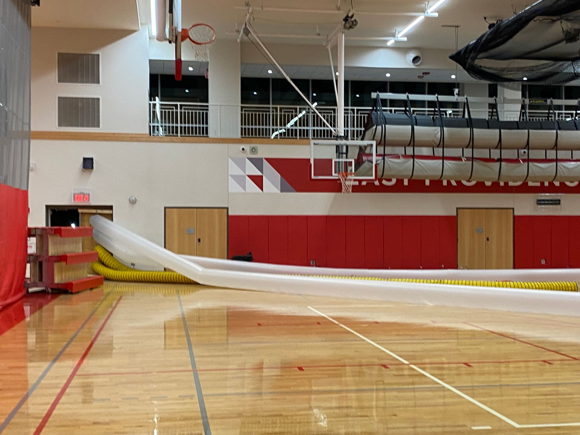 A basketball court with the word providers on the wall