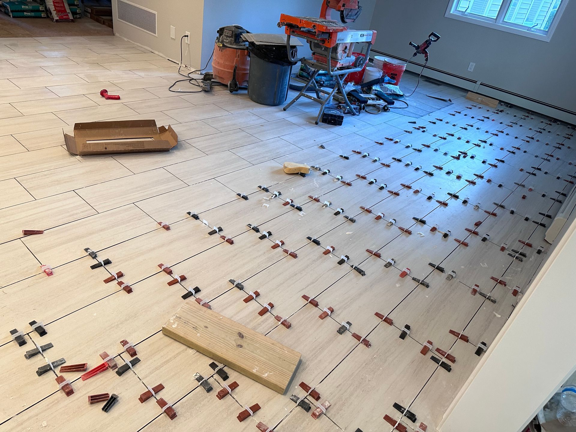 A large room with a lot of tiles on the floor.