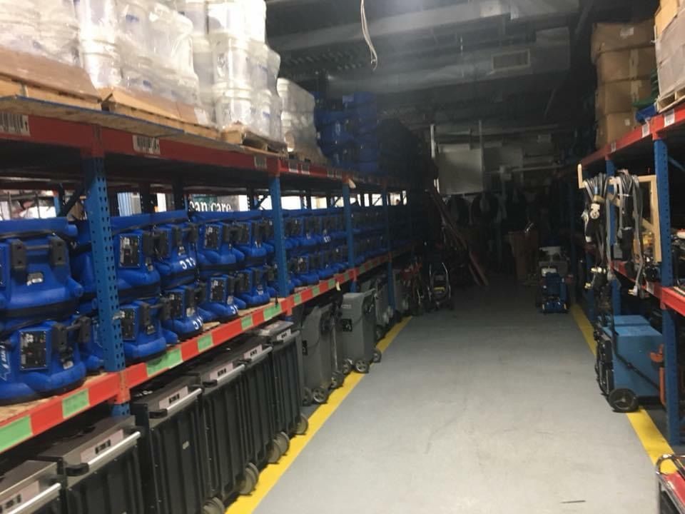 A warehouse filled with lots of luggage on shelves.