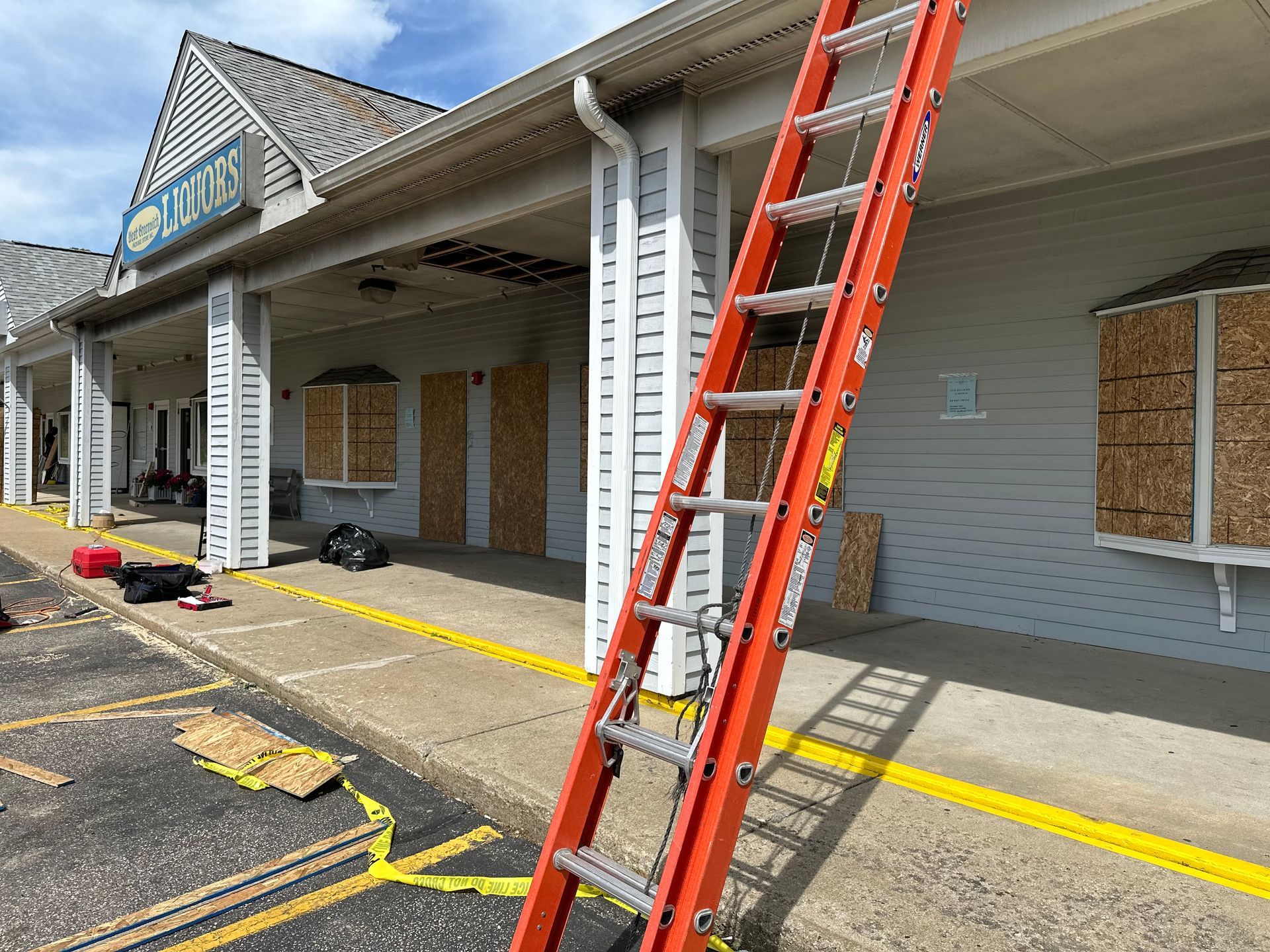 A ladder is leaning against the side of a building.