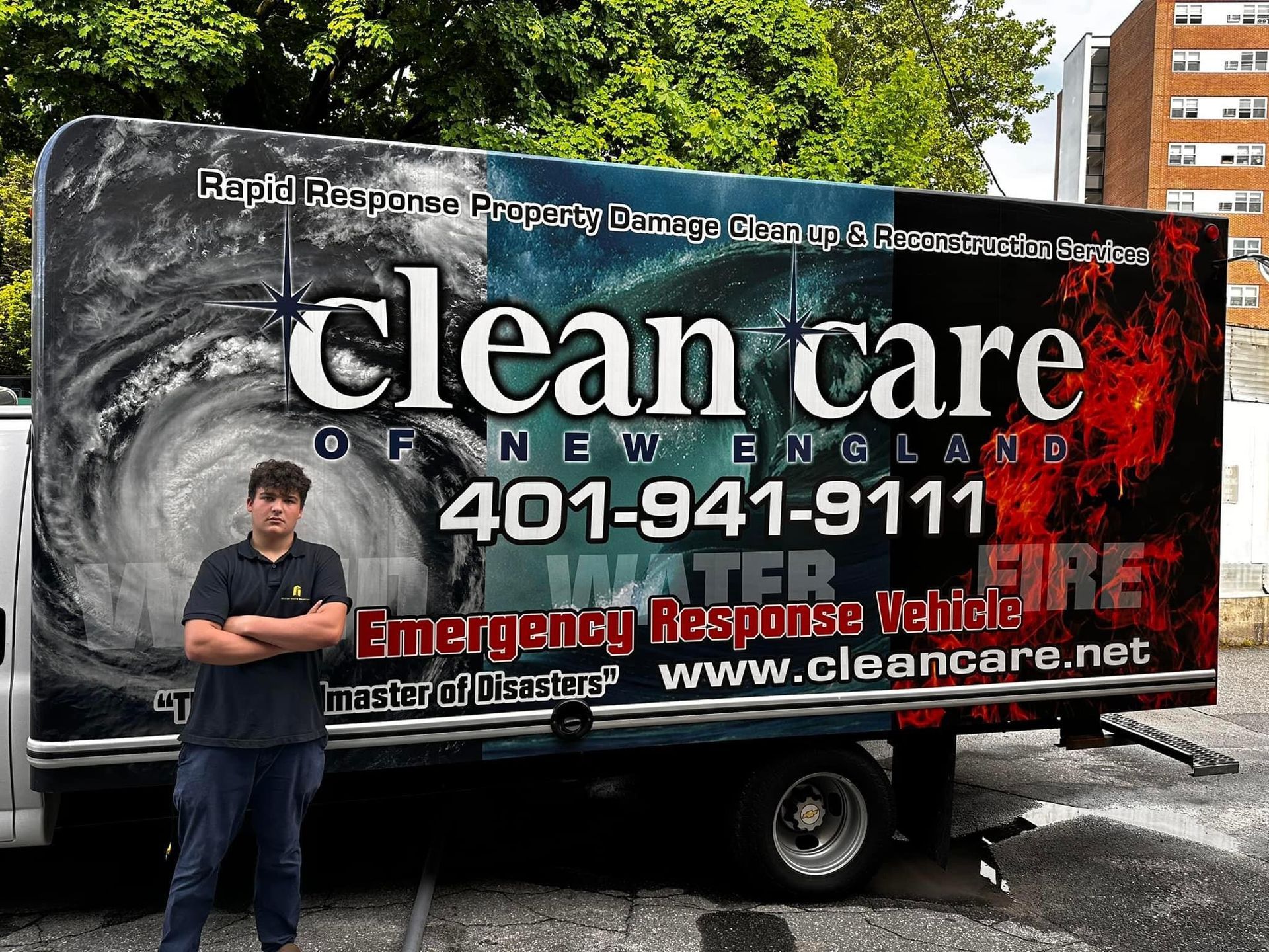 A man stands in front of a clean care truck