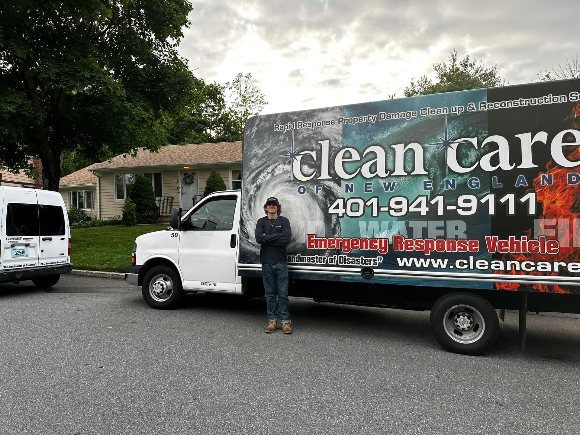 A man stands in front of a clean care truck