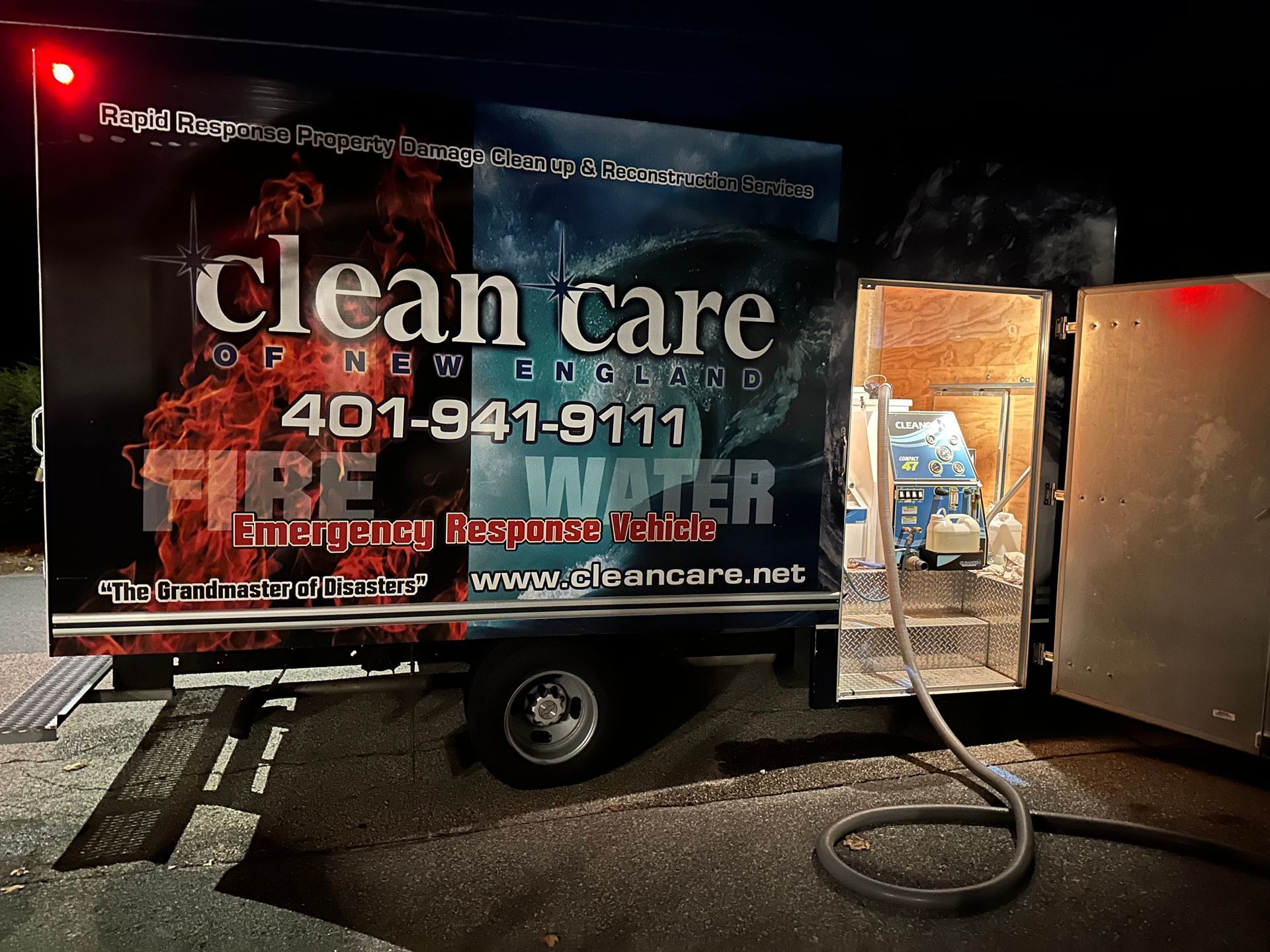 A clean care truck with a hose attached to it