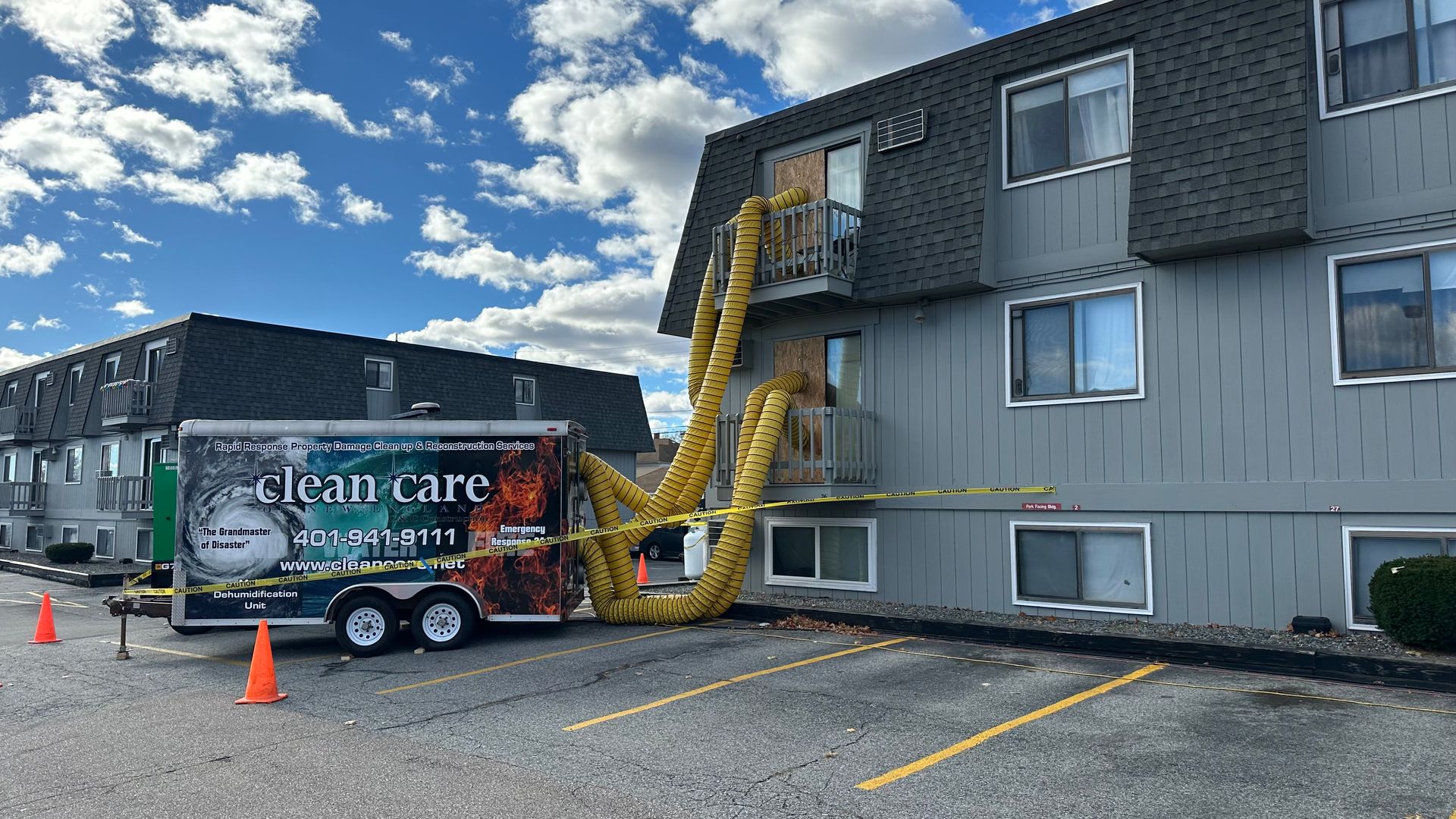 A large building with a trailer parked in front of it.