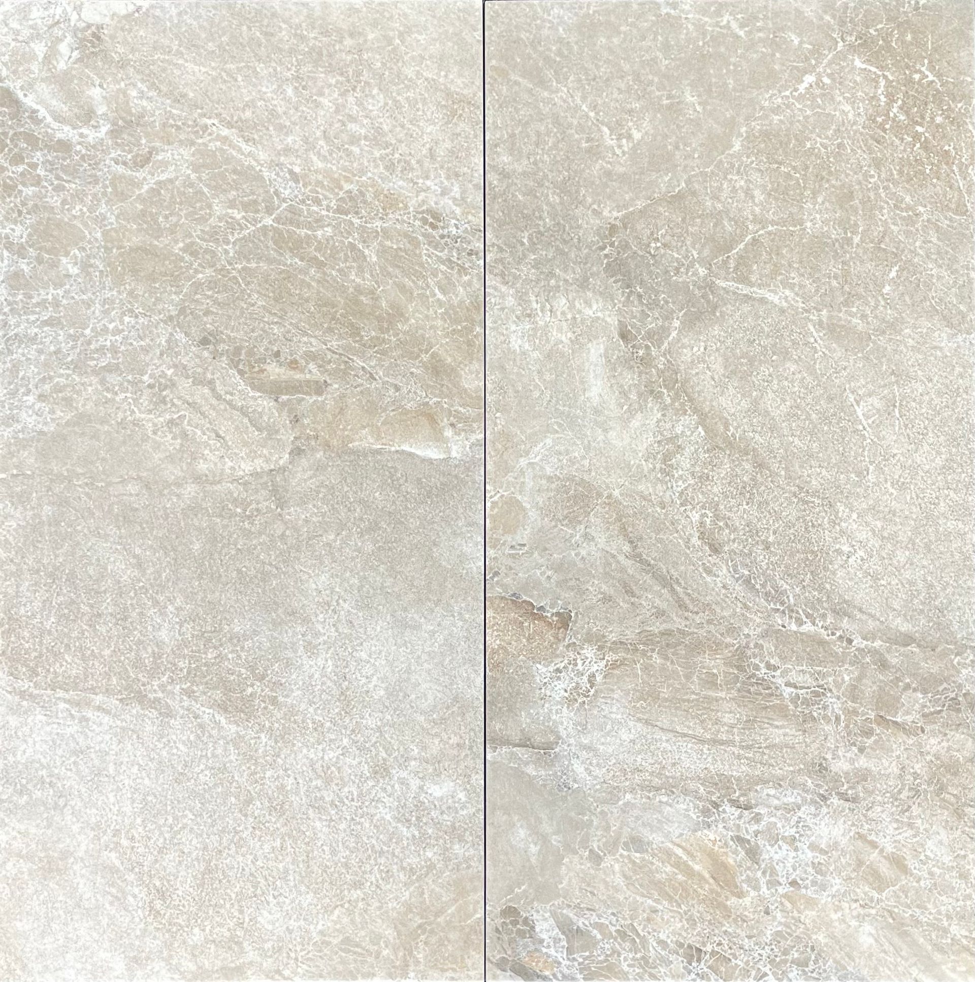 Two beige stone tiles with a mottled surface.