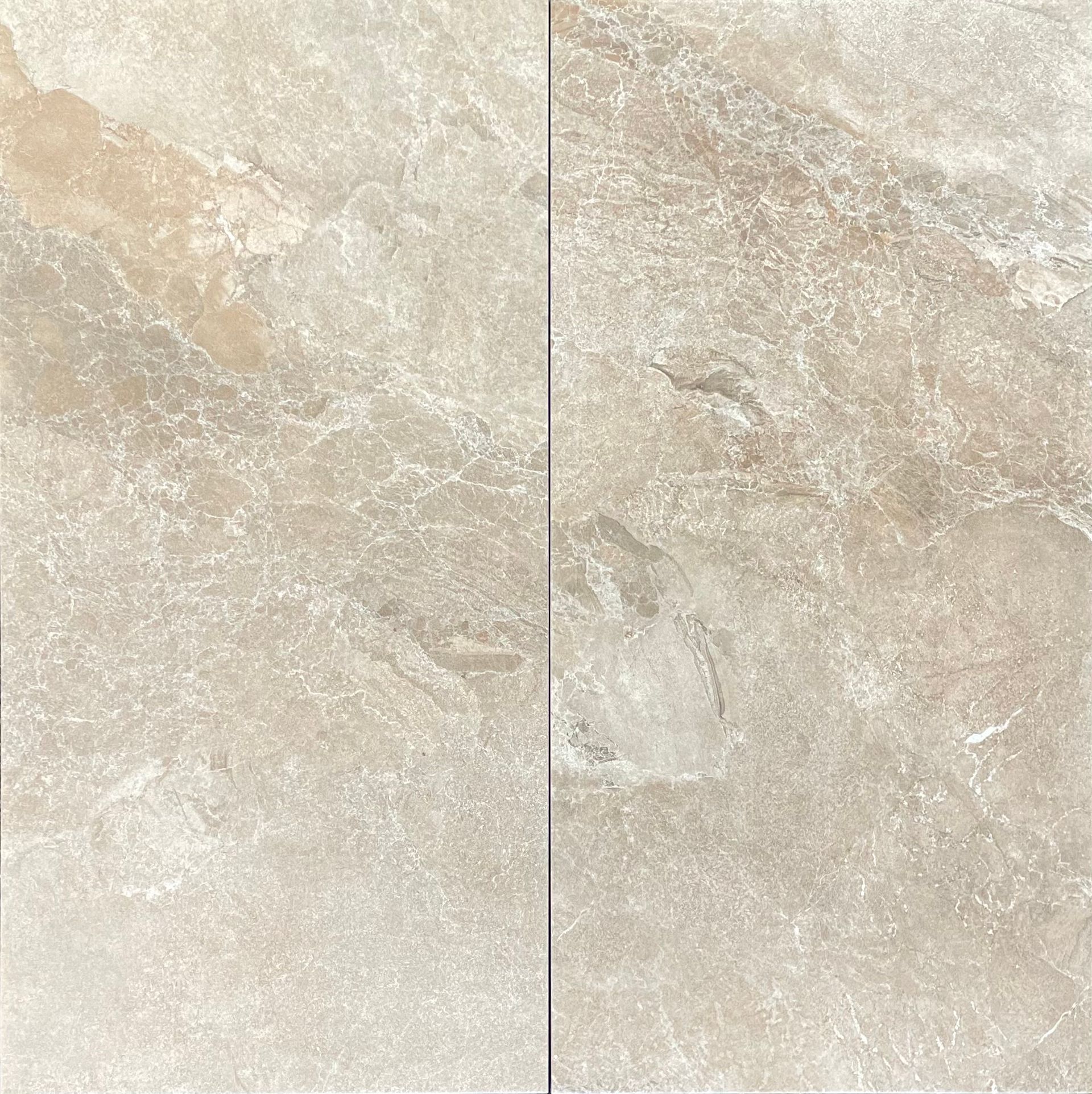 Two beige, textured stone tiles with variations in tone.