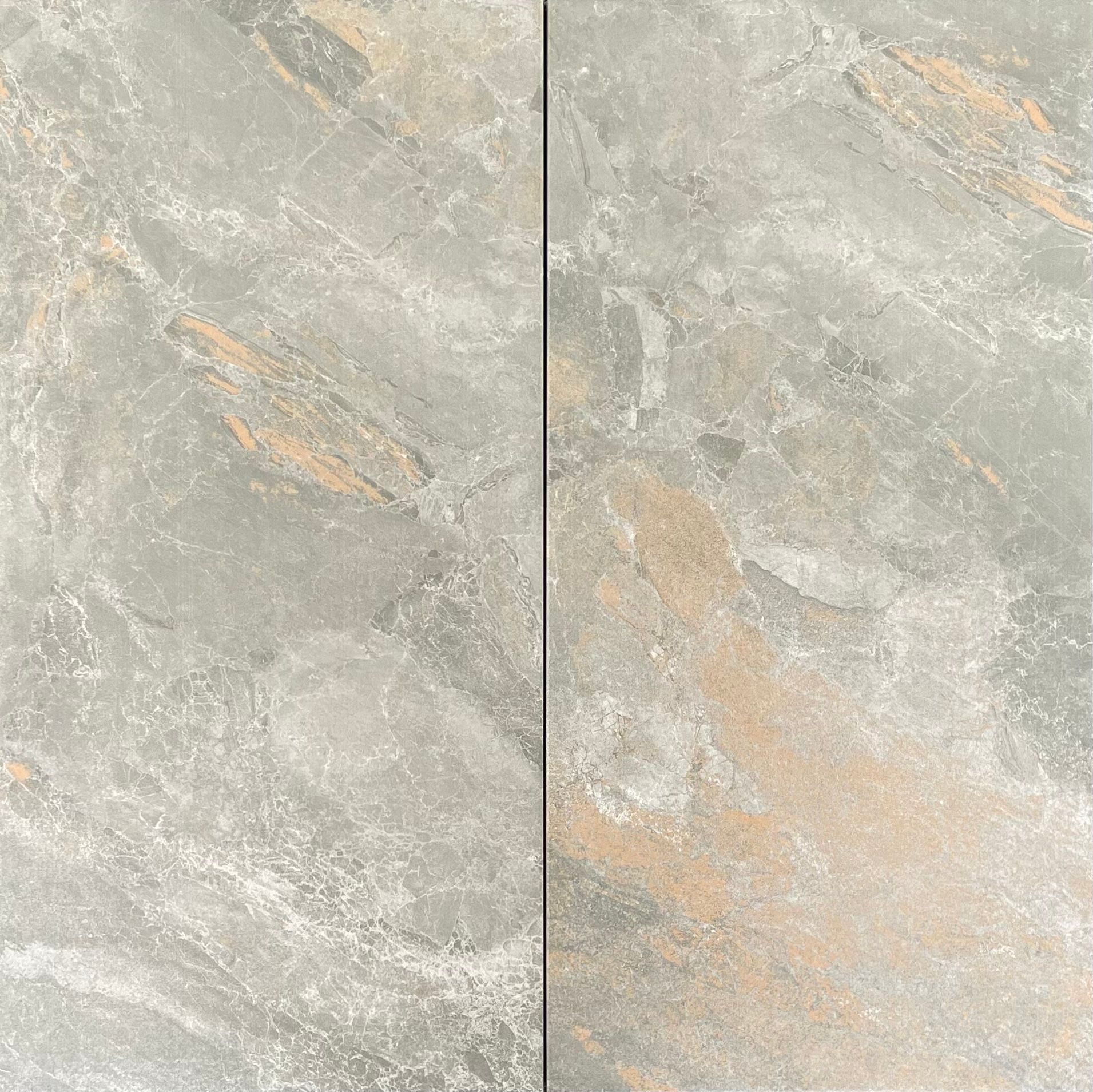 Two gray and beige stone tiles with a marbled texture.