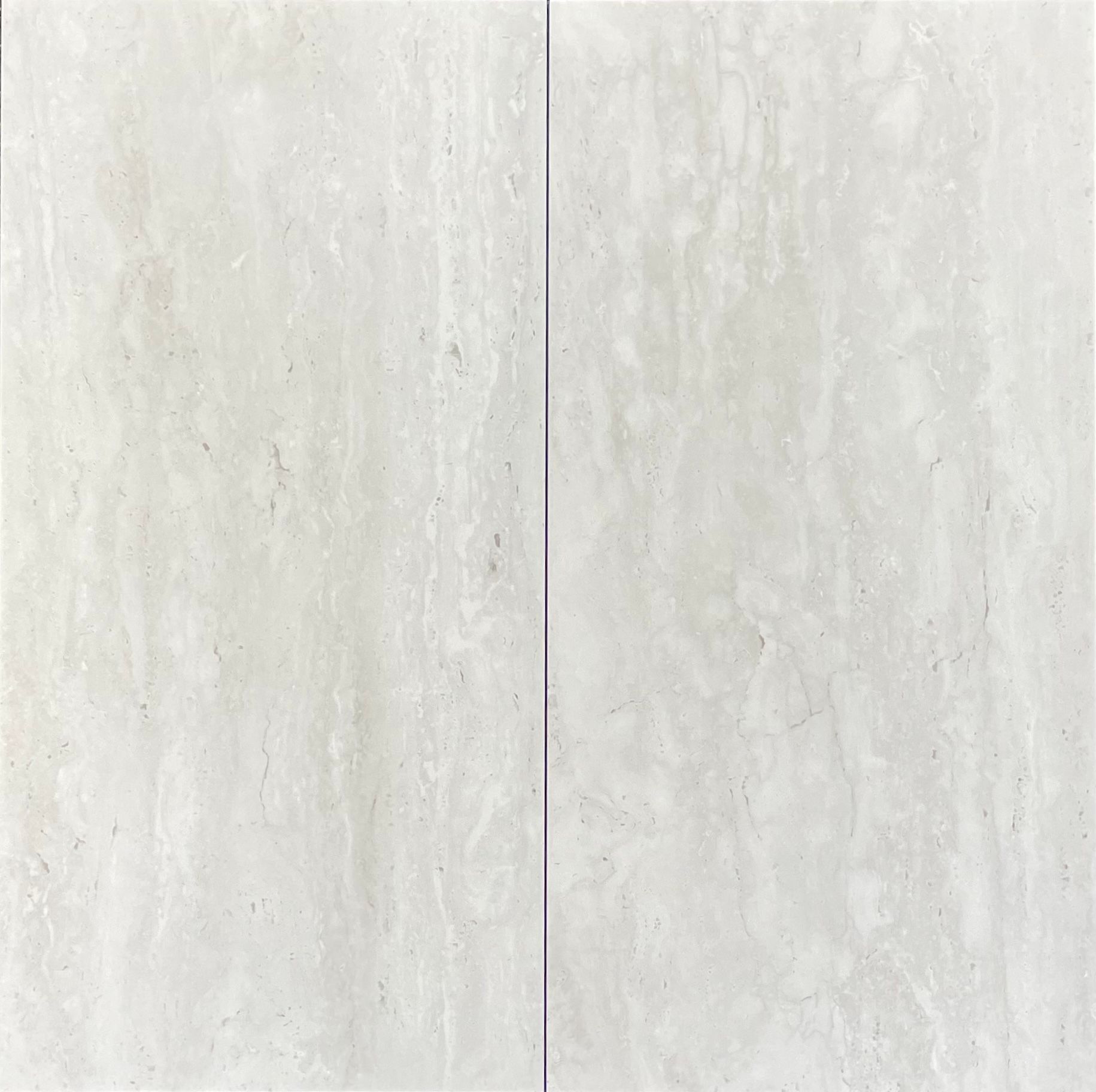 Two light-colored rectangular stone tiles with vertical streaks, separated by a thin, dark line.