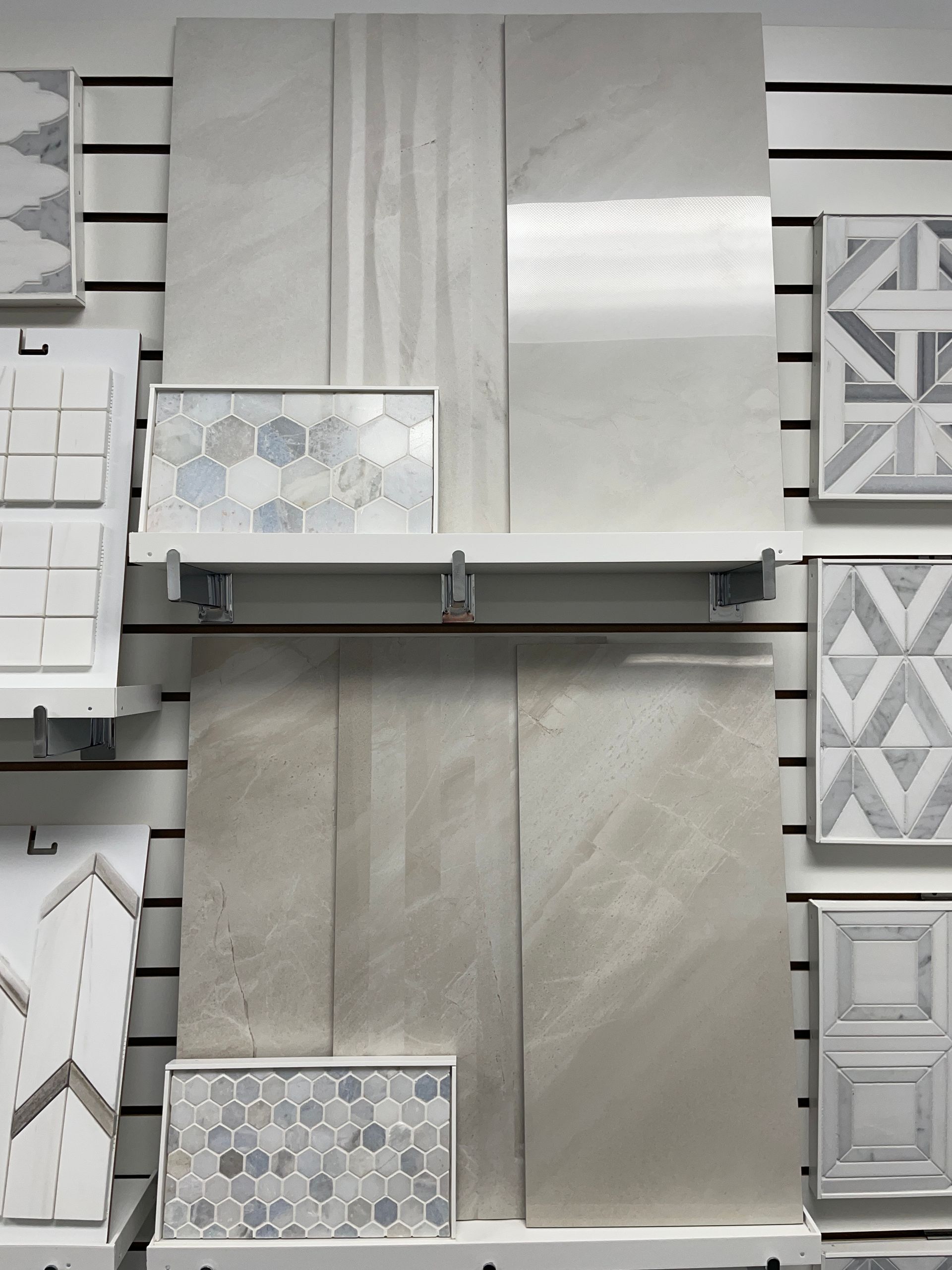 A display of tiles on a wall in a store