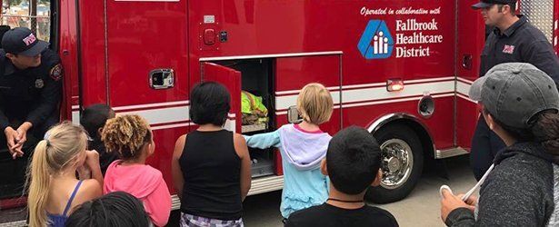 Kids looking at the fire truck