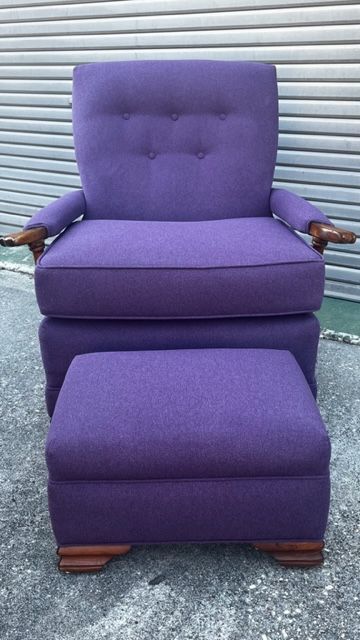 Purple upholstered armchair with matching ottoman, set outdoors.