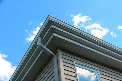 The house has a roof installed with a gutter system