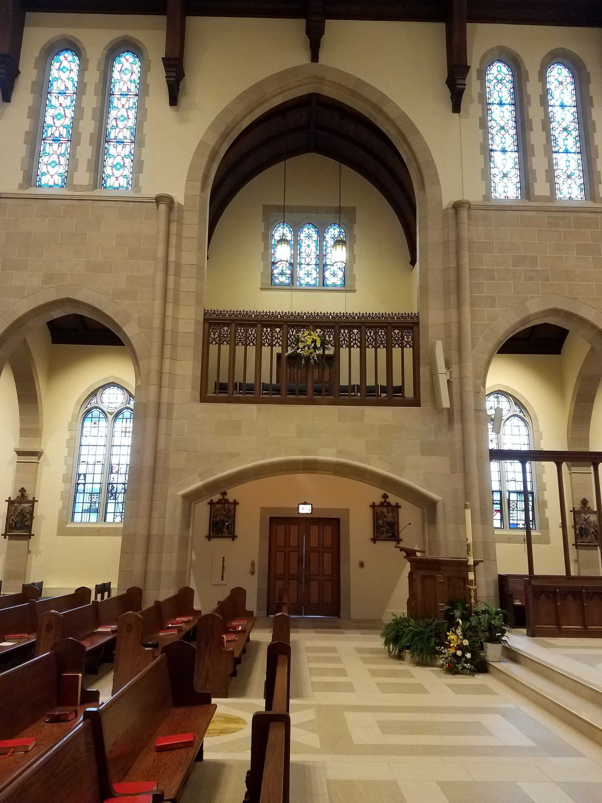 The inside of a church with stained glass windows