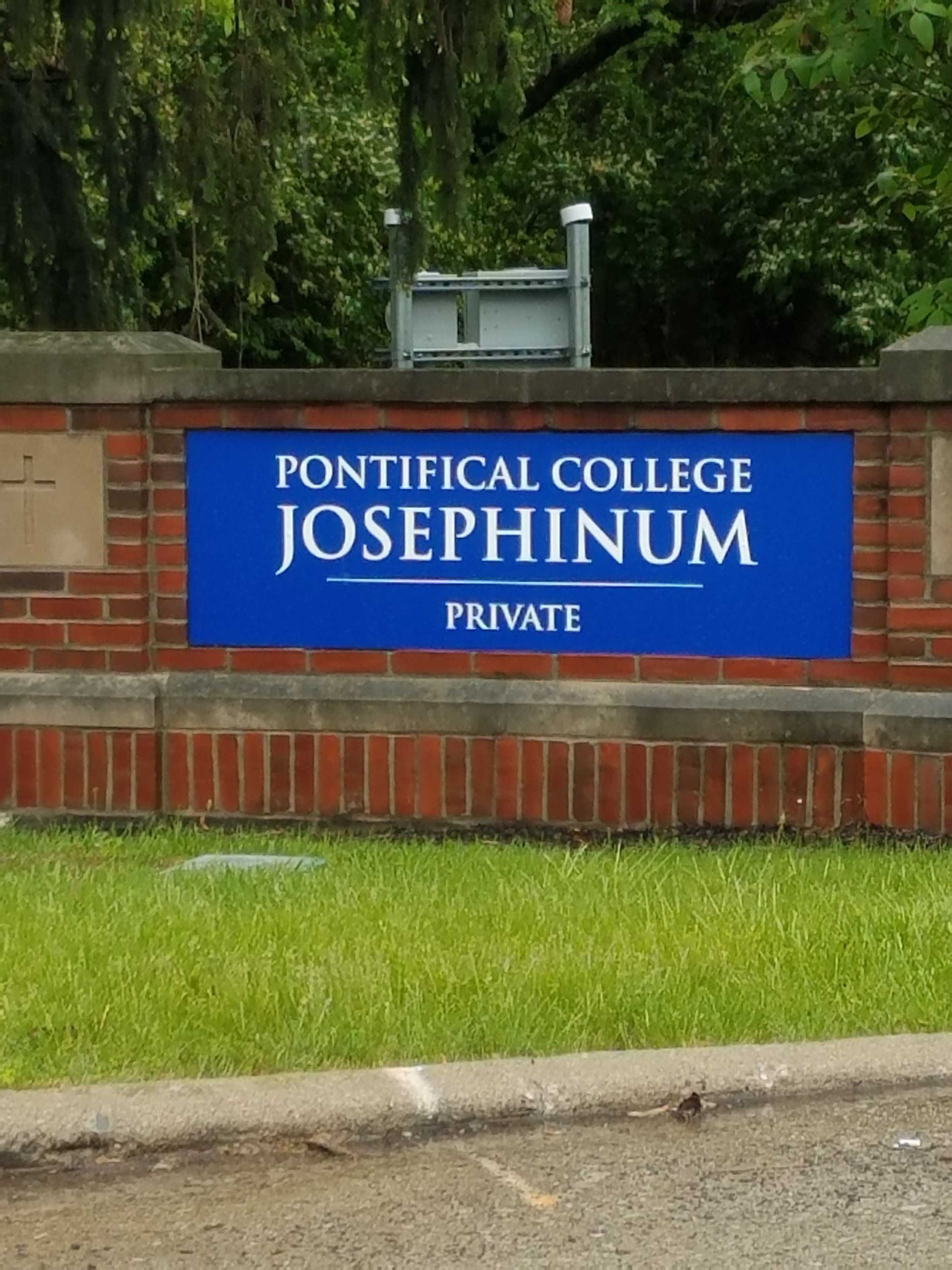 A blue sign for pontificial college josephinum private