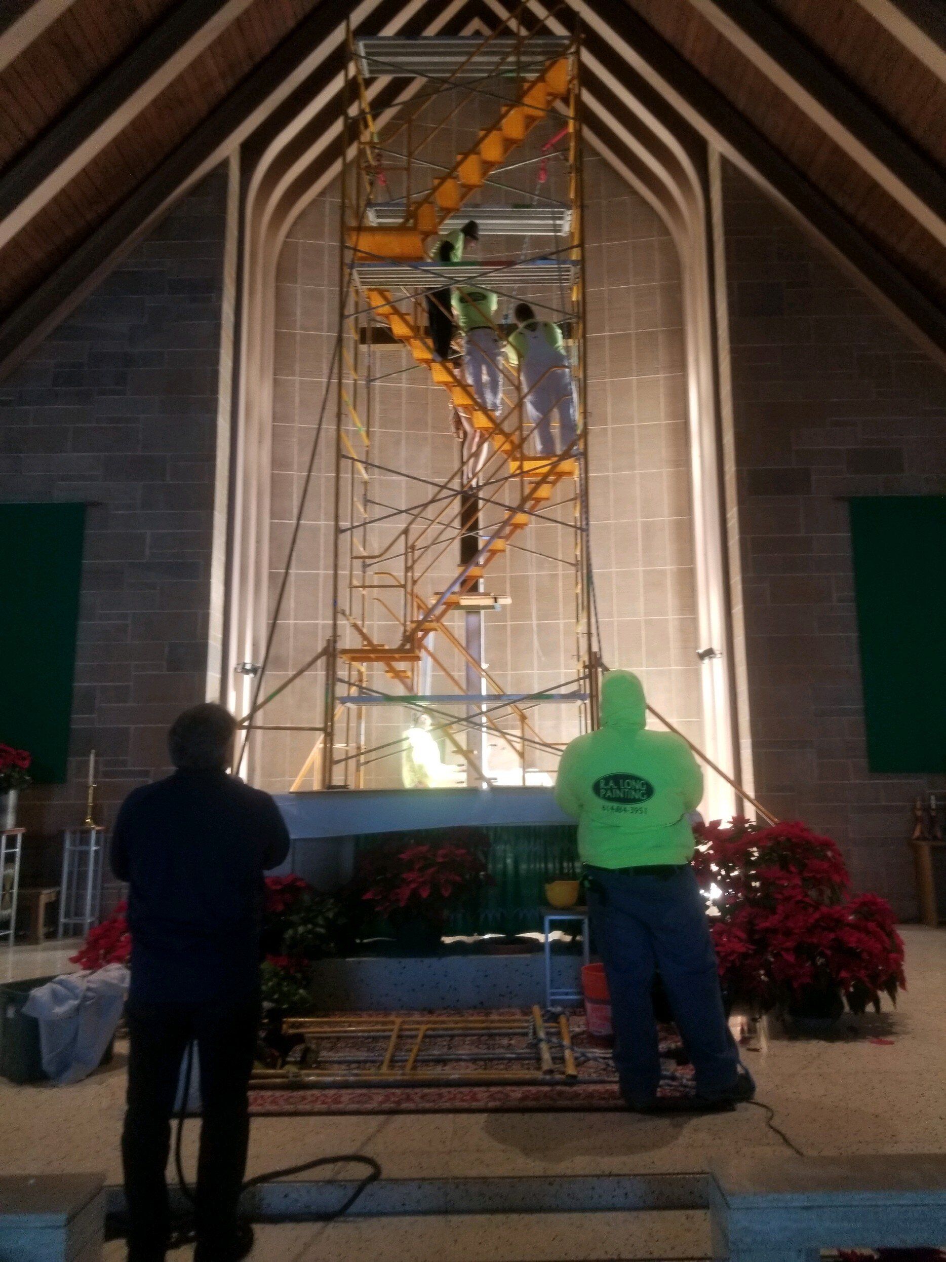 A man wearing a green shirt that says ' scaffolding ' on it
